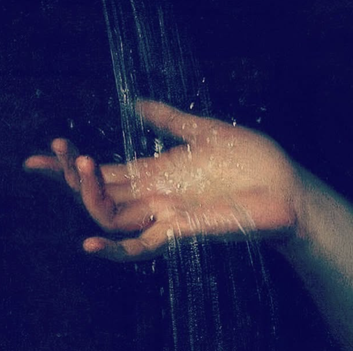 Lobby Magazine cover — hand under falling water
